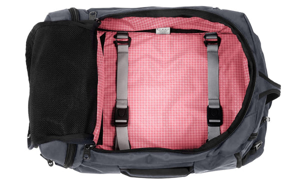An open Techonaut 30 with a Nebulous Grey (dark grey) exterior and an Sakura (pale pink) interior.